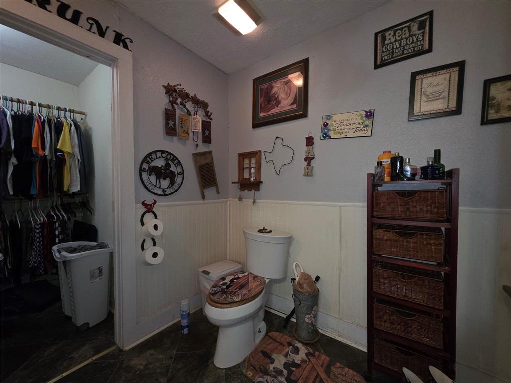 211 West Sabine Street Groesbeck, TX 76642 - Photo 28 of 40 a bathroom with a toilet and a sink