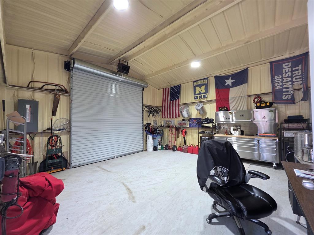 211 West Sabine Street Groesbeck, TX 76642 - Photo 38 of 40 a view of a livingroom with workspace and a window