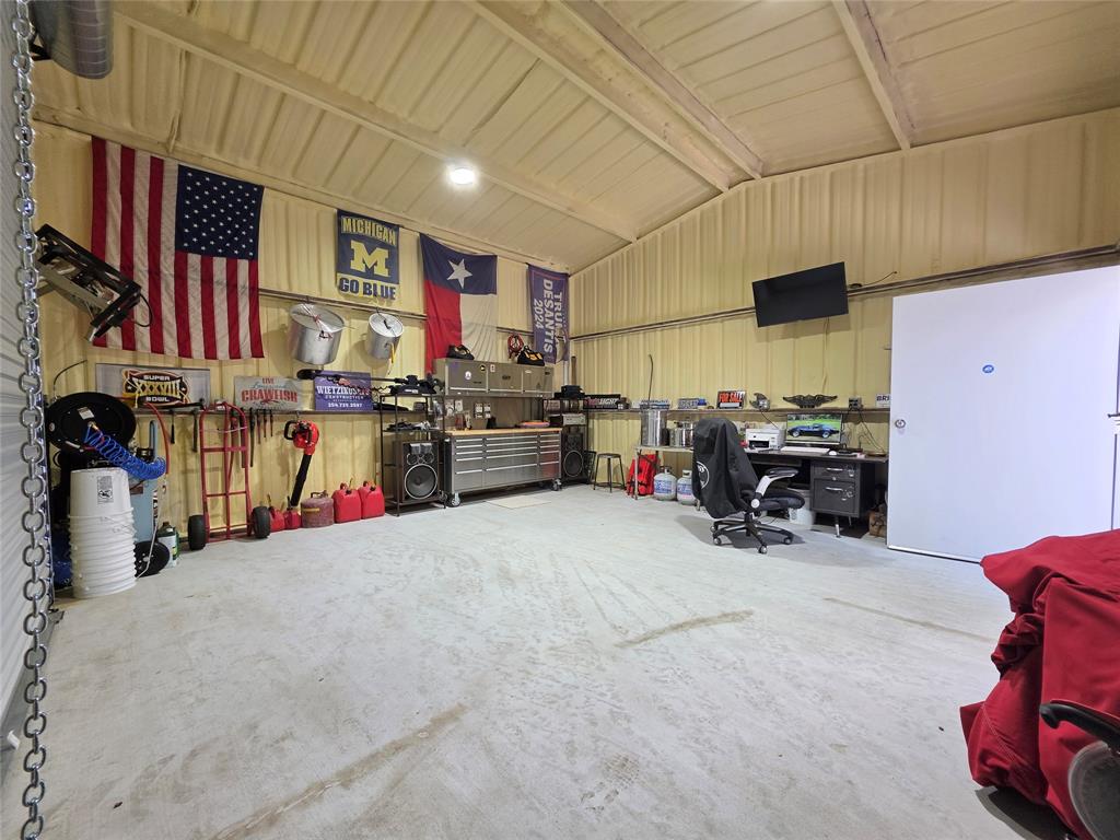 211 West Sabine Street Groesbeck, TX 76642 - Photo 39 of 40 a bed room with a bed and a television