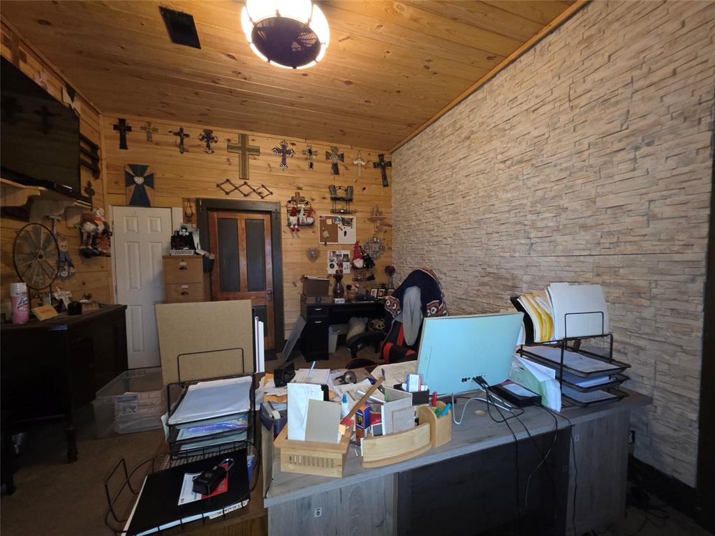 211 West Sabine Street Groesbeck, TX 76642 - Photo 10 of 40 a view of workspace with wooden floor