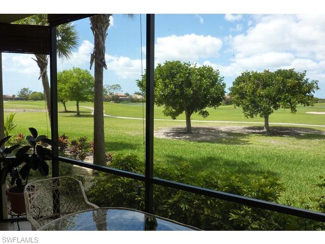 8613 Champions Point, Unit 302 Naples, FL 34113 - Photo 4 of 10 a view of outdoor space with swimming pool