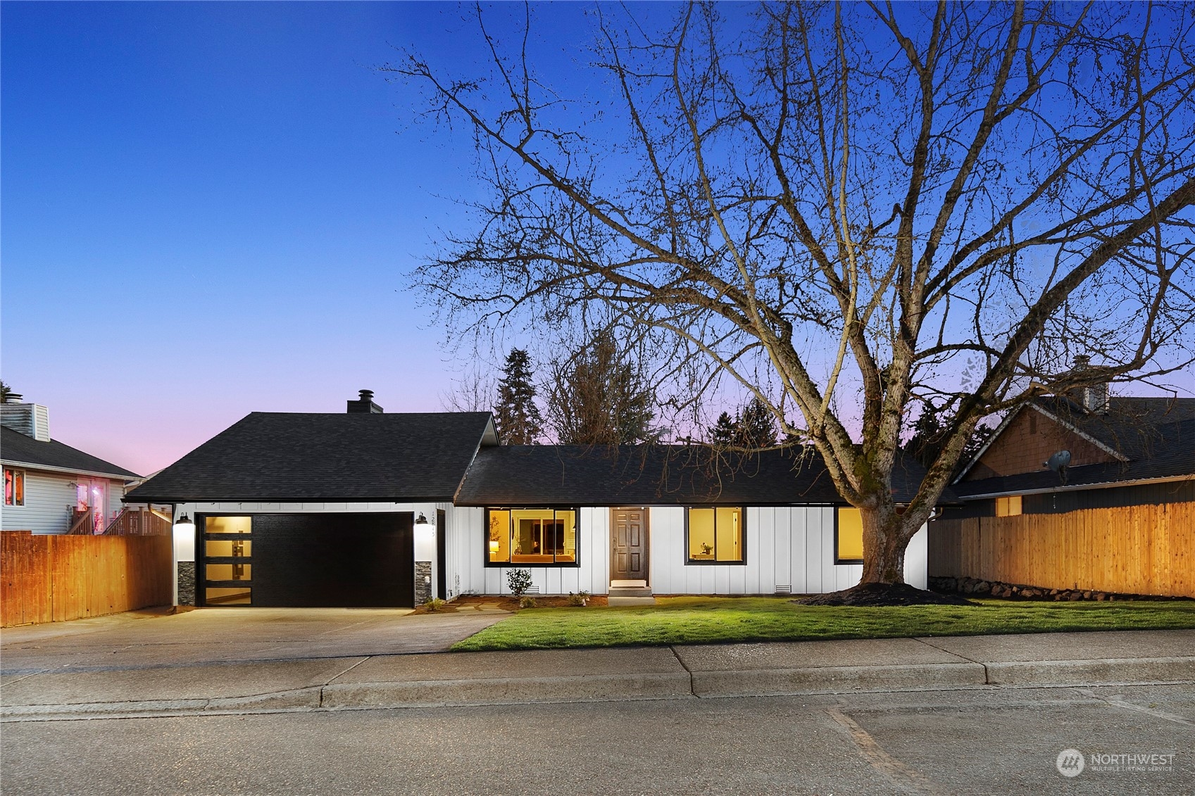 12845 Southeast 258th Street Kent, WA 98030 - Photo 1 of 35 a view of a house with a yard