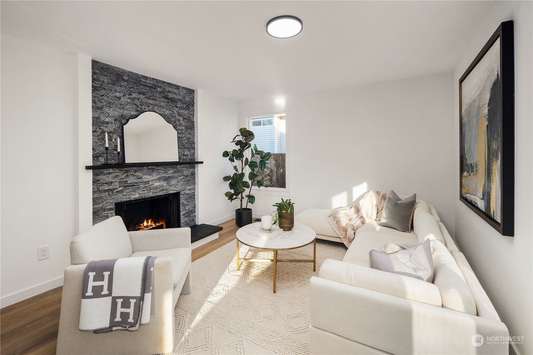 12845 Southeast 258th Street Kent, WA 98030 - Photo 25 of 35 a living room with furniture and a fireplace