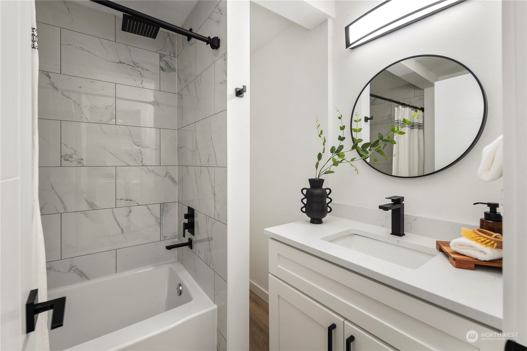 12845 Southeast 258th Street Kent, WA 98030 - Photo 27 of 35 a bathroom with a sink and a mirror
