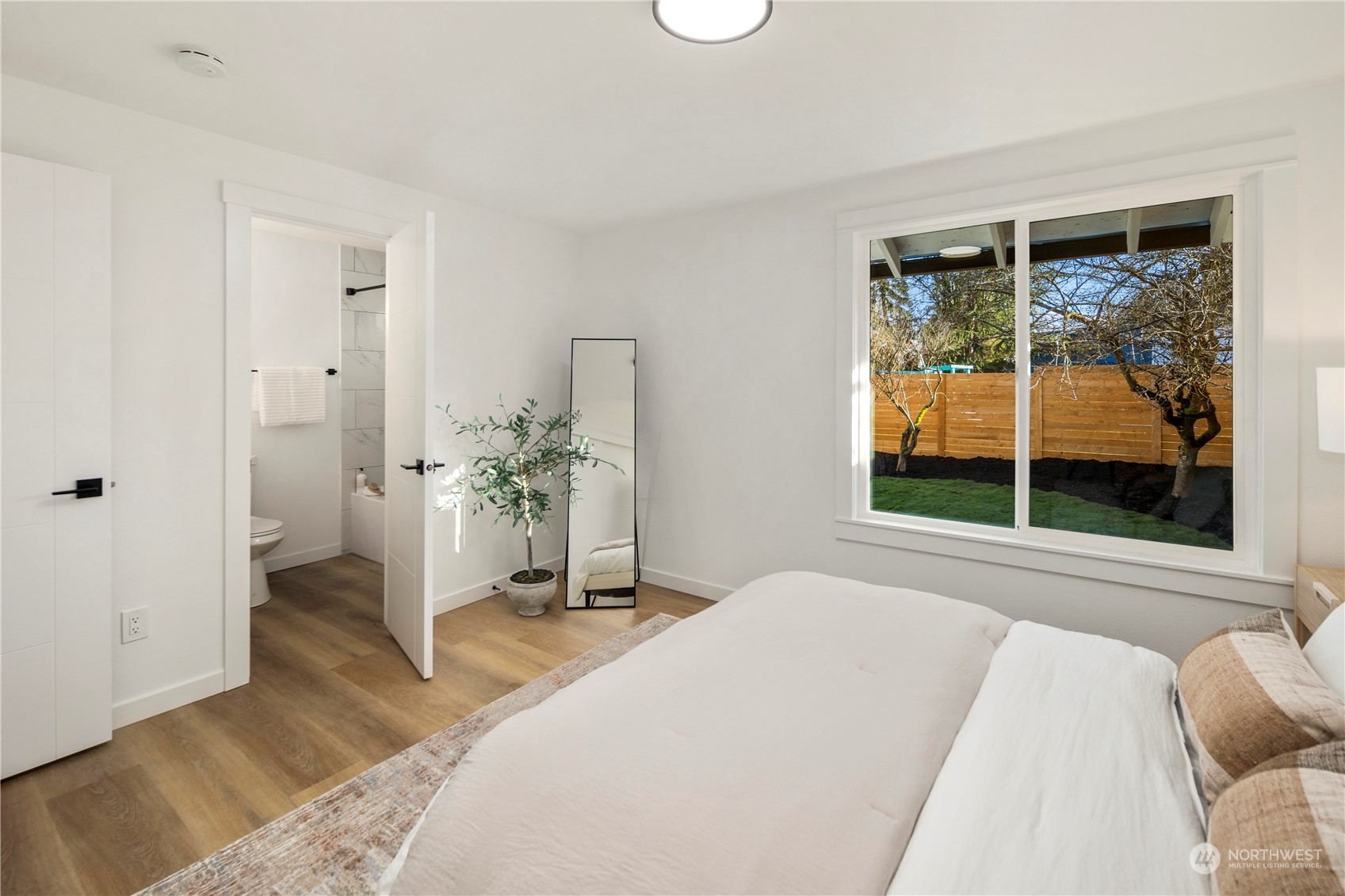 12845 Southeast 258th Street Kent, WA 98030 - Photo 29 of 35 a bedroom with a bed and a window