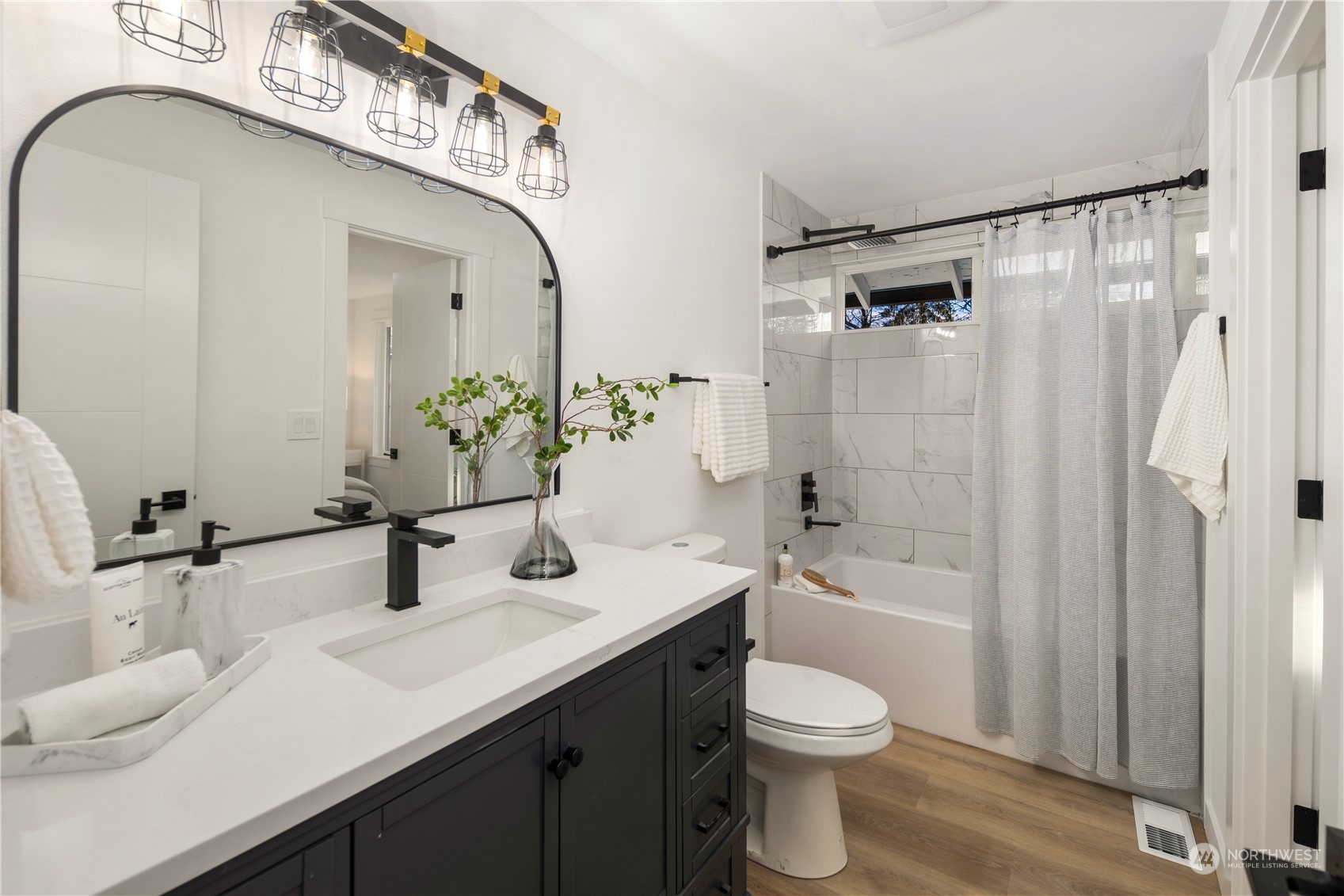 12845 Southeast 258th Street Kent, WA 98030 - Photo 30 of 35 a bathroom with a sink a toilet and shower