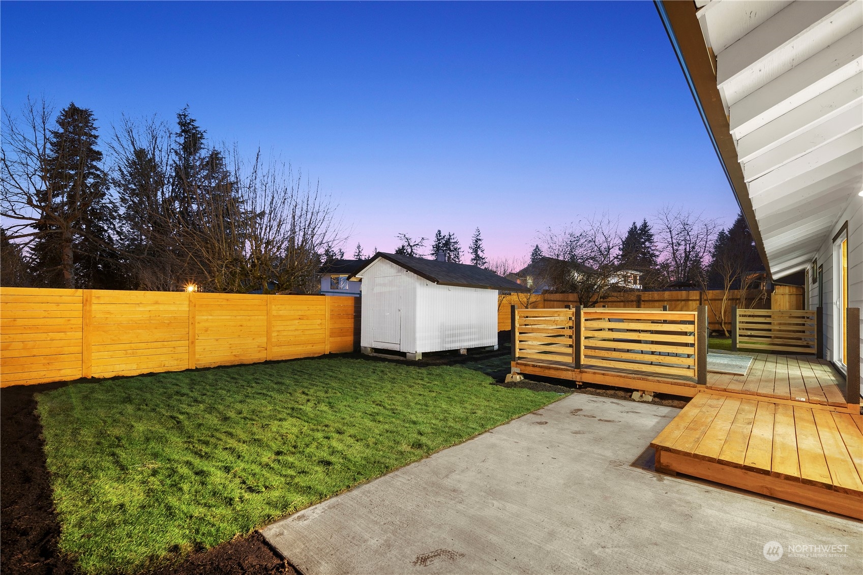 12845 Southeast 258th Street Kent, WA 98030 - Photo 5 of 35 a view of a backyard with a house