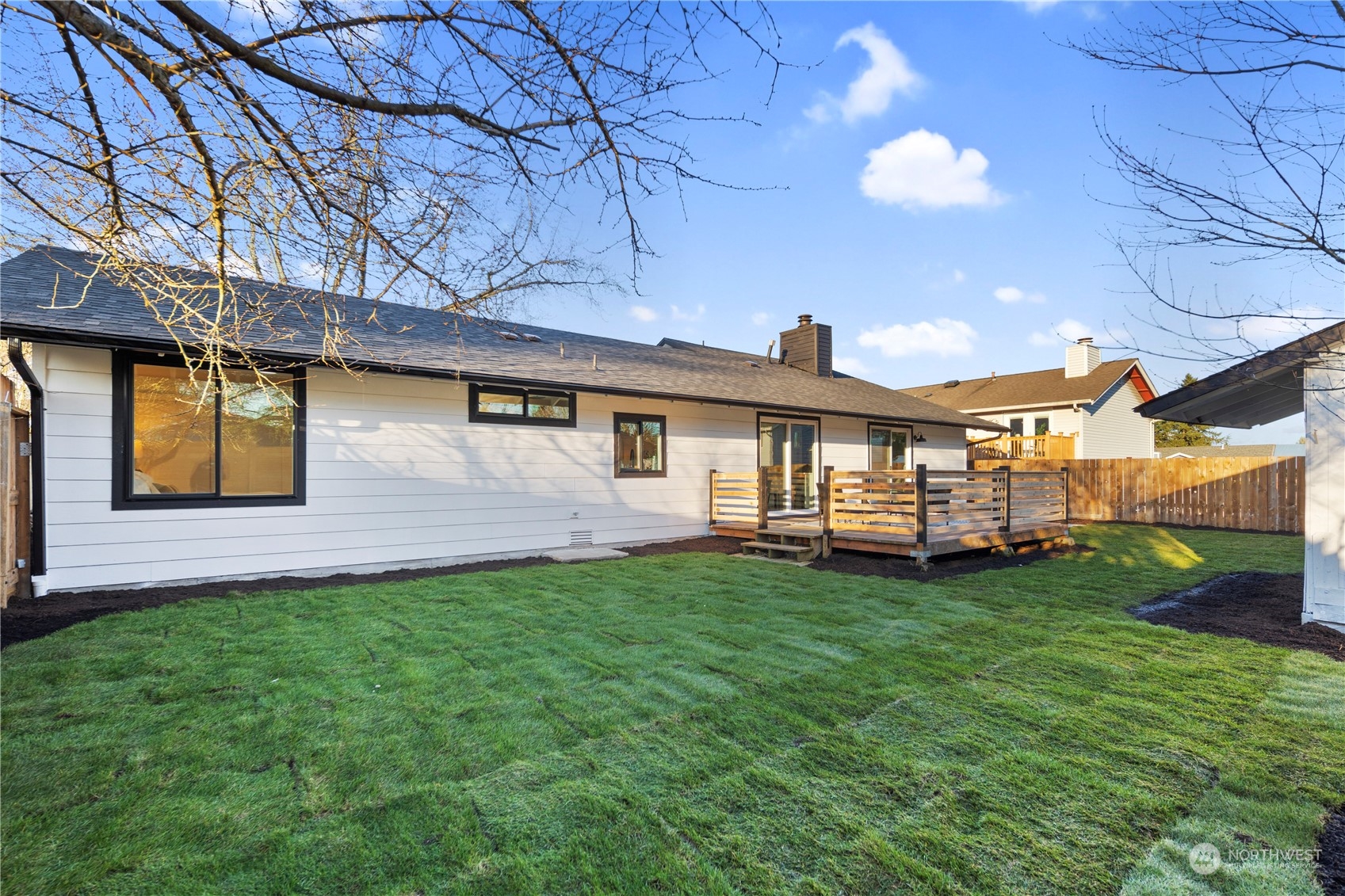 12845 Southeast 258th Street Kent, WA 98030 - Photo 6 of 35 a view of a house with a yard and sitting area