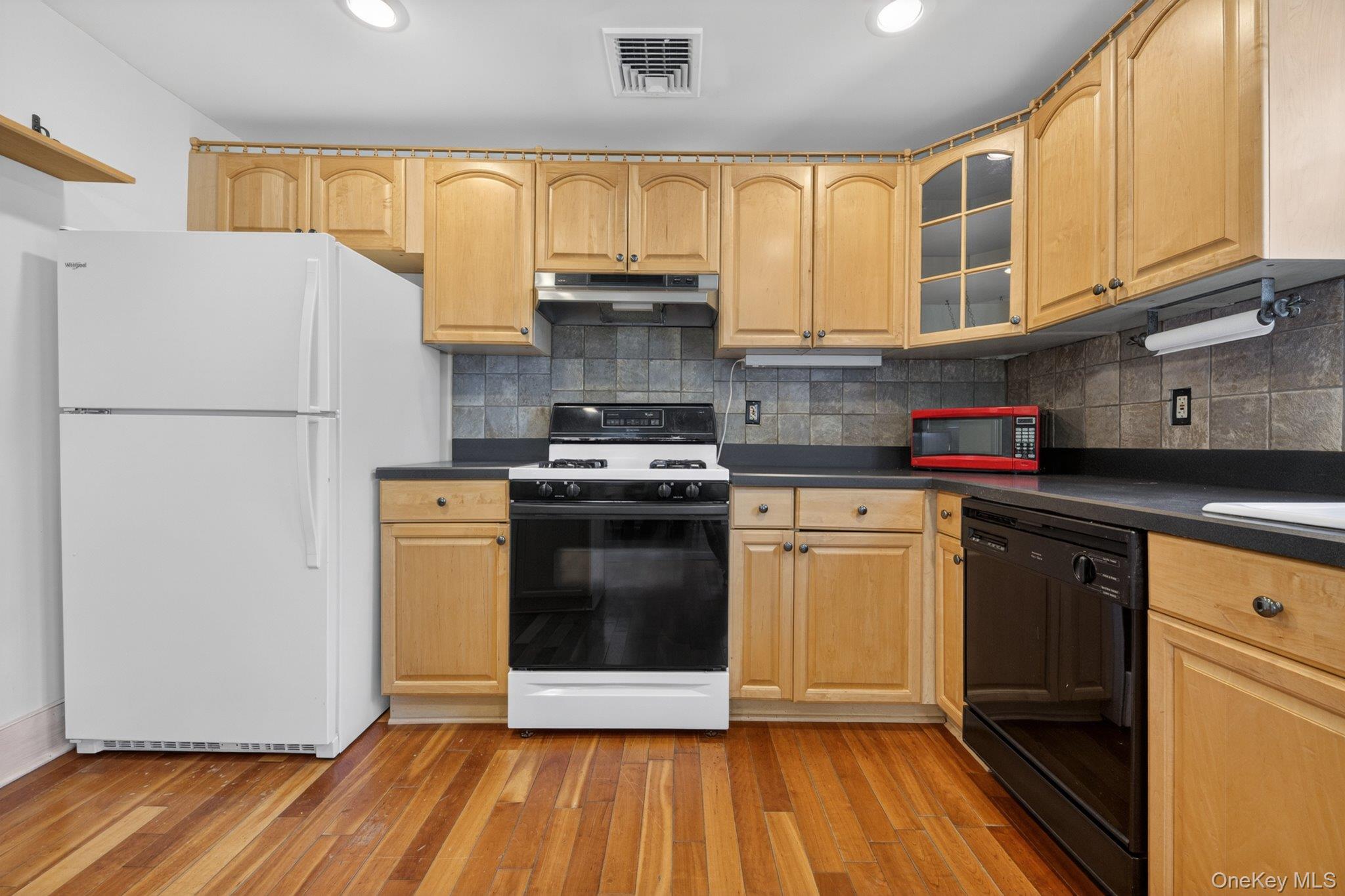250 Rombout Avenue Beacon, NY 12508 - Photo 13 of 33 a kitchen with a white cabinets and white appliances