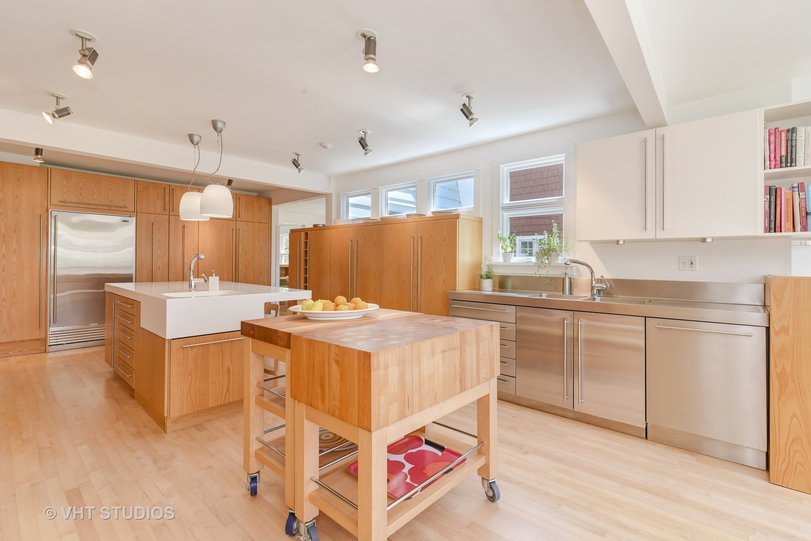 2234 Forestview Road Evanston, IL 60201 - Photo 15 of 76 a kitchen that has a lot of white cabinets and stainless steel appliances