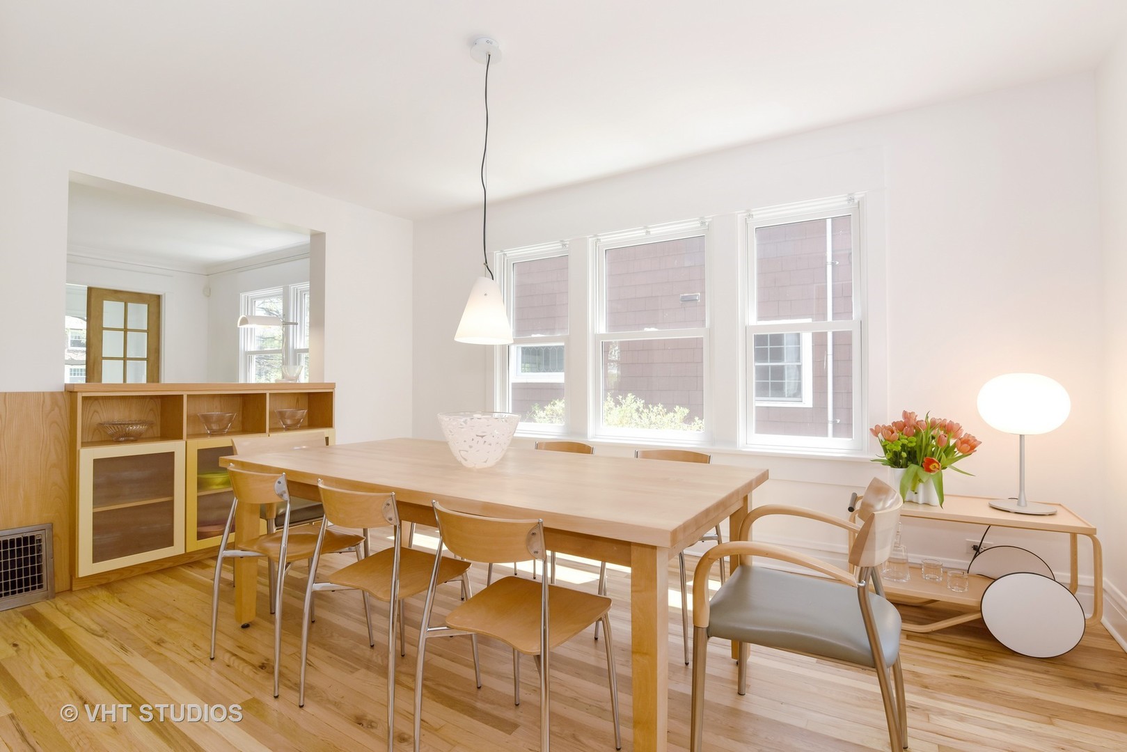 2234 Forestview Road Evanston, IL 60201 - Photo 17 of 76 a view of a dining room with furniture and wooden floor