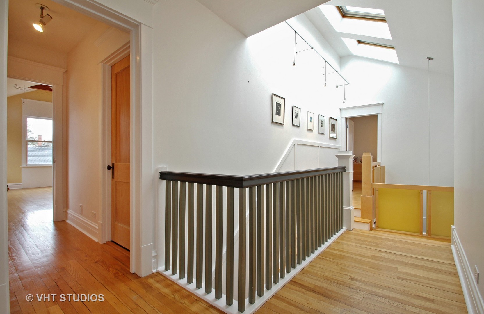 2234 Forestview Road Evanston, IL 60201 - Photo 37 of 76 a view of a hallway with wooden floor and staircase