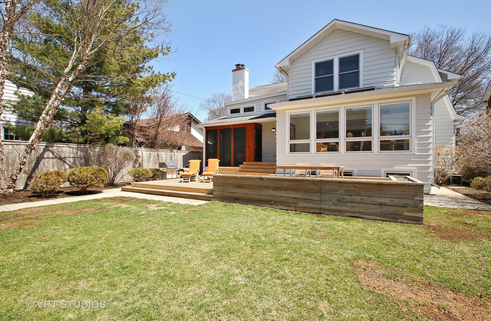 2234 Forestview Road Evanston, IL 60201 - Photo 45 of 76 a front view of a house with a yard table and chairs