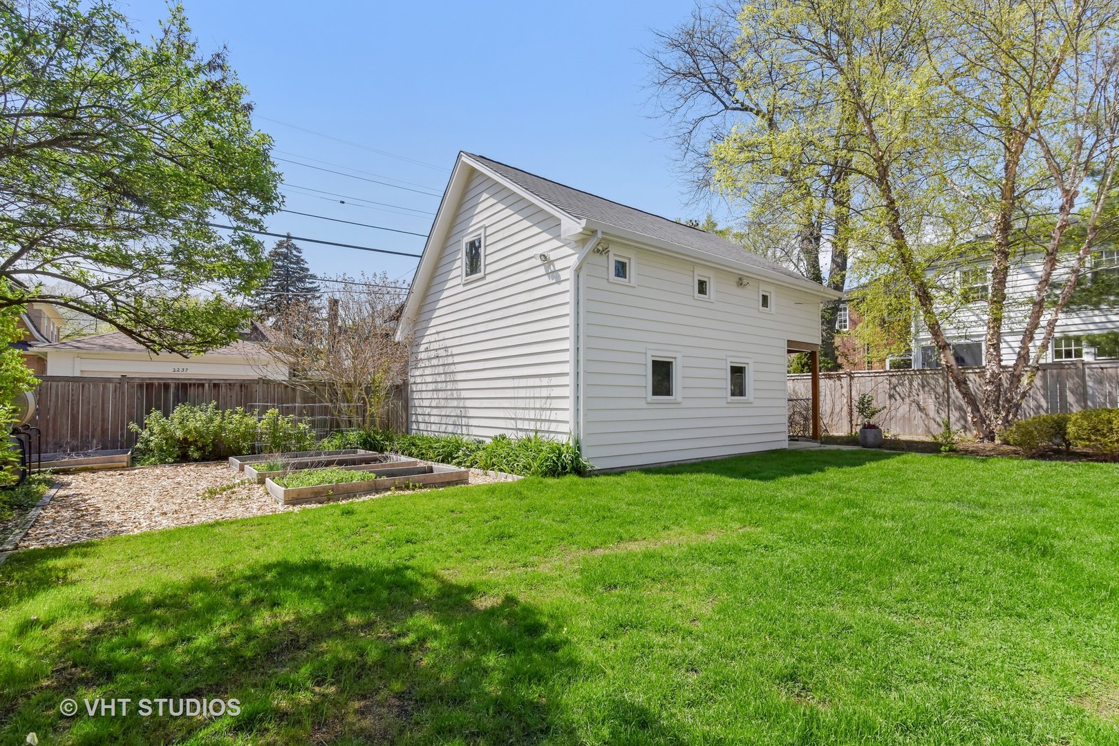 2234 Forestview Road Evanston, IL 60201 - Photo 64 of 76 a view of a backyard with plants and large tree