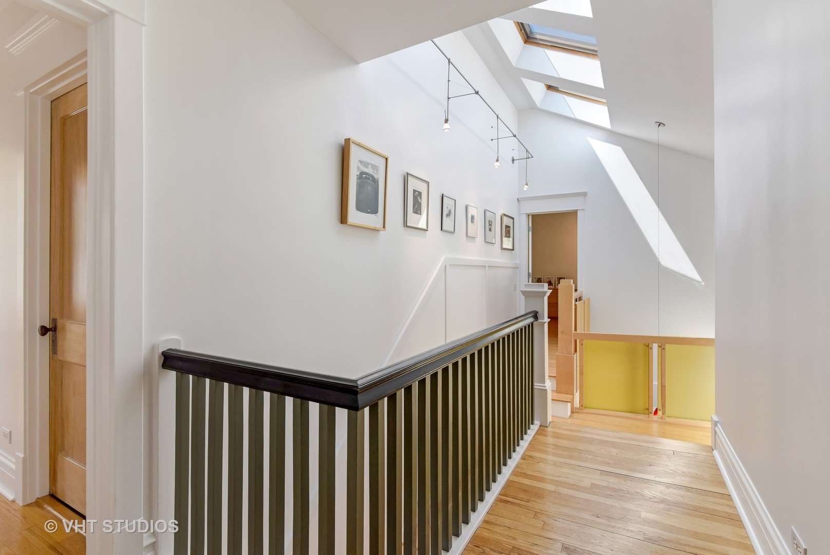 2234 Forestview Road Evanston, IL 60201 - Photo 74 of 76 a view of a hallway with wooden floor and staircase