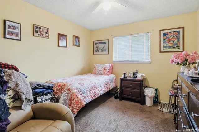 a bedroom with a bed and dresser