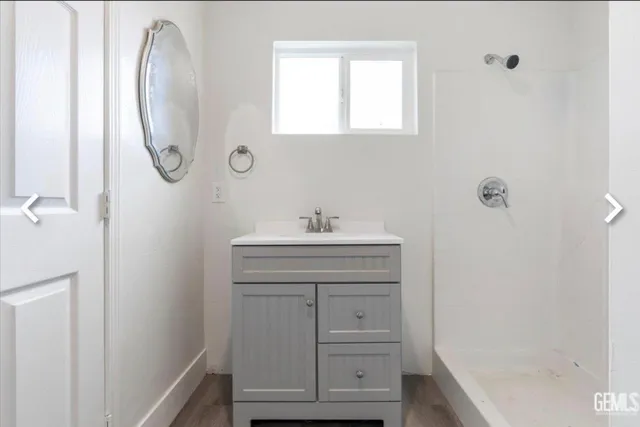 a bathroom with a sink a vanity and a mirror