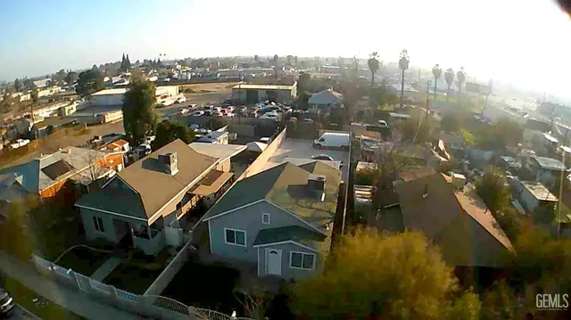 an aerial view of a residential apartment building with a yard