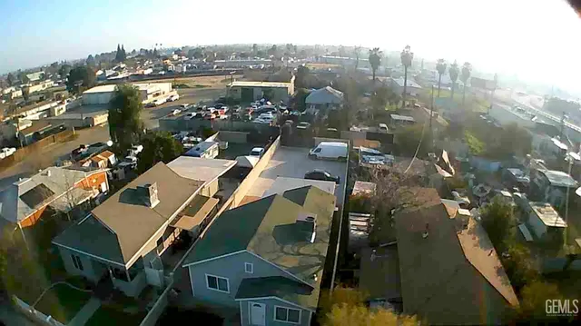 an aerial view of a house with a lake view