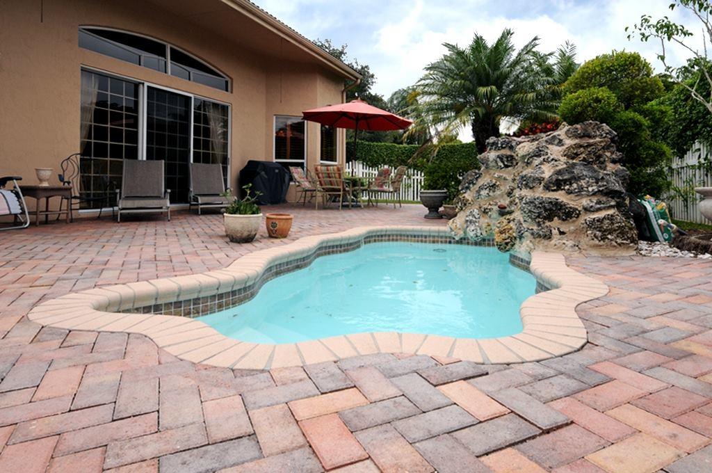 22123 Braddock Place Boca Raton, FL 33428 - Photo 24 of 26 Tropical Splash Pool with Waterfall