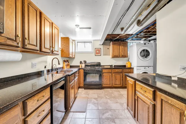 a bathroom with a granite countertop sink mirror and shower