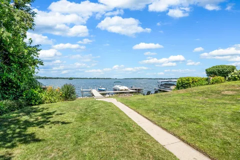 a view of a lake with couches