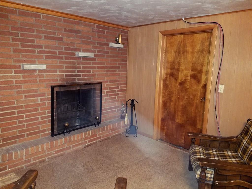 403 Whitestown Road Butler, PA 16001 - Photo 18 of 23 Basement offers a huge family room (not pictured) with an additional sitting area in font of the fireplace and a bathroom.