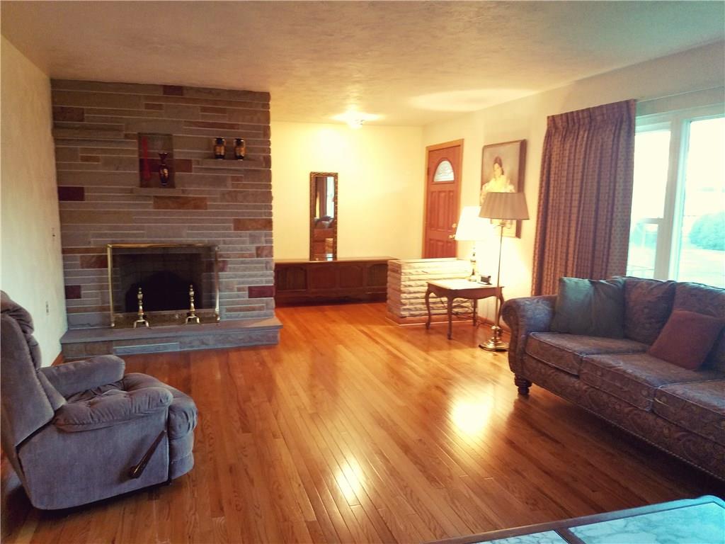 403 Whitestown Road Butler, PA 16001 - Photo 4 of 23 Large family room on the main level with refinished hardwood and fireplace.