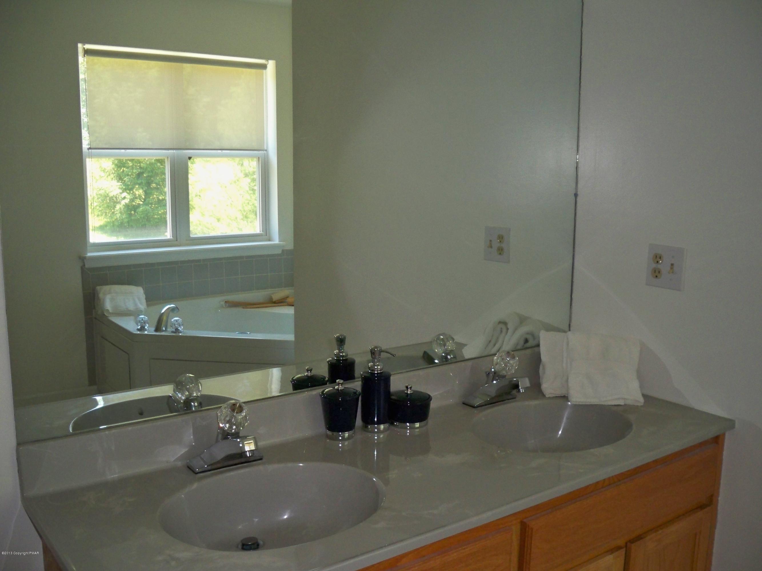 420 Blue Ridge Road Saylorsburg, PA 18353 - Photo 25 of 32 a bathroom with a sink and a window