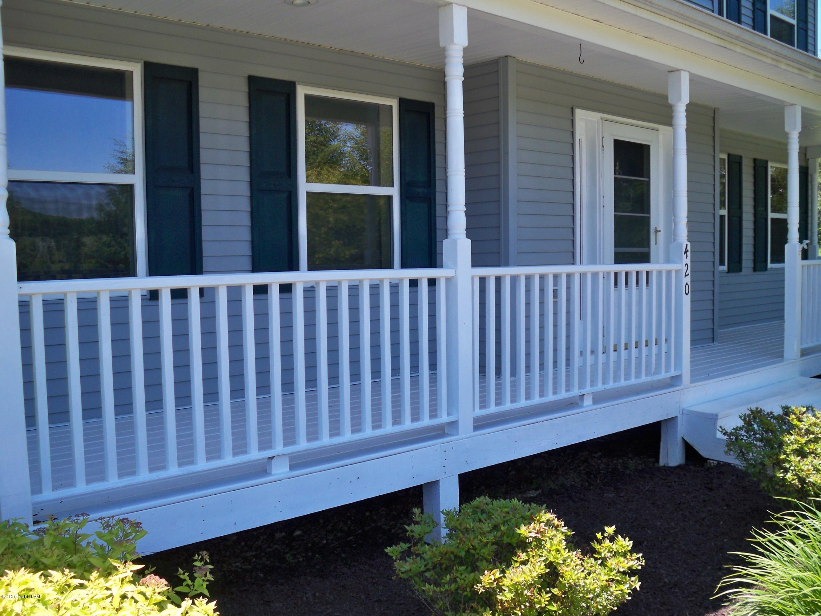 420 Blue Ridge Road Saylorsburg, PA 18353 - Photo 4 of 32 a view of a deck with a yard