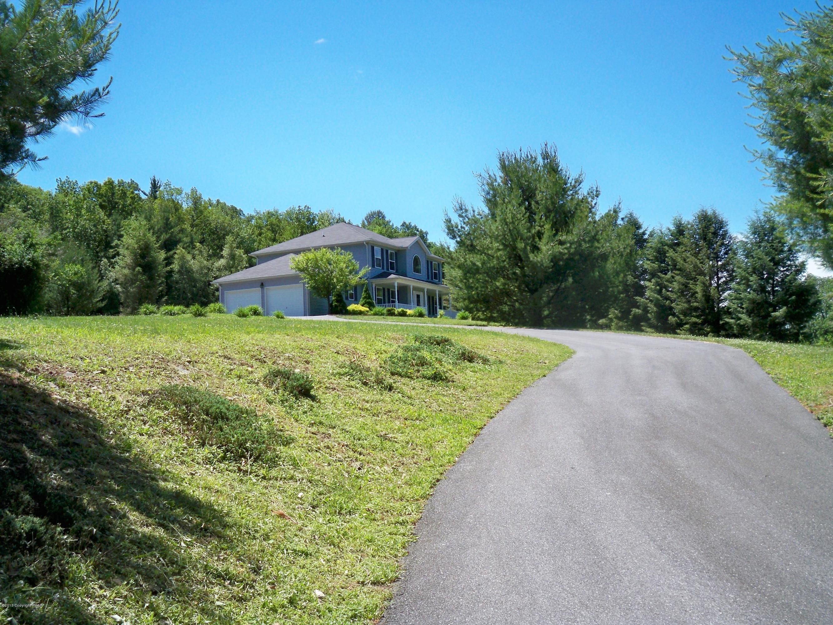 420 Blue Ridge Road Saylorsburg, PA 18353 - Photo 10 of 32 a view of a grassy area with an trees