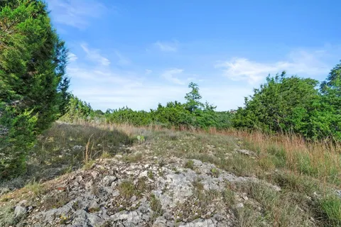 a view of a lake with top of house