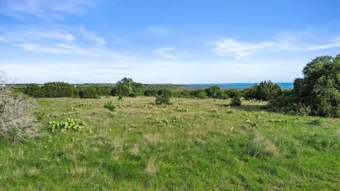 a view of a forest with an aerial view of residential houses with outdoor space
