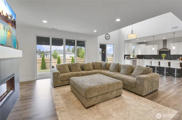 a living room with furniture and a large window