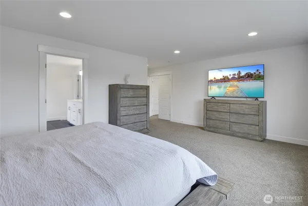 a bedroom with a bed and a cabinets