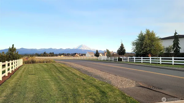a view of a swimming pool with a lake view and mountain view