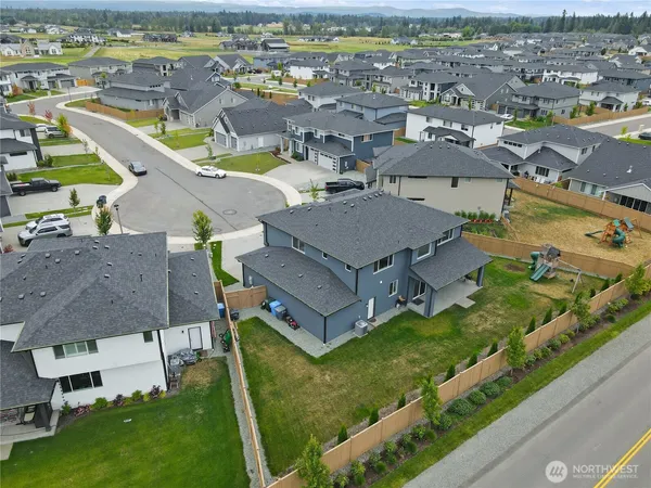 an aerial view of a house with a garden