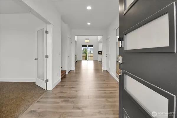 a view of a hallway with the wooden floor