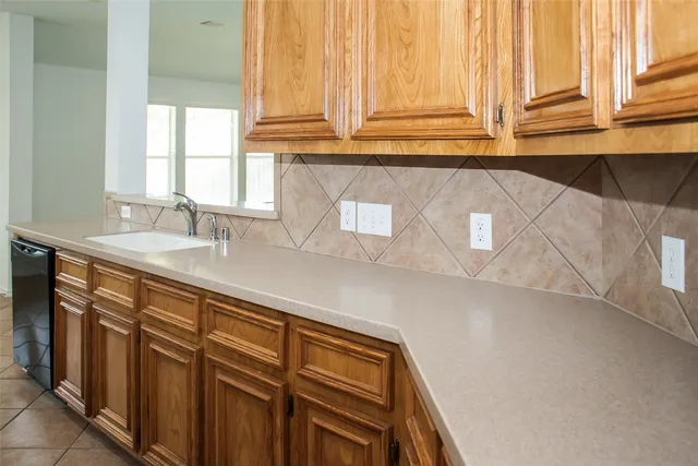 a view of a hallway with wooden floor and a chandelier