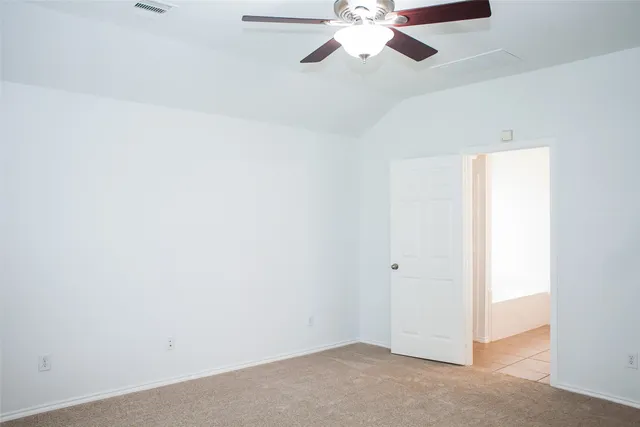 a view of a backyard with a garden and deck