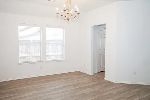 a kitchen with granite countertop a sink cabinets and stainless steel appliances