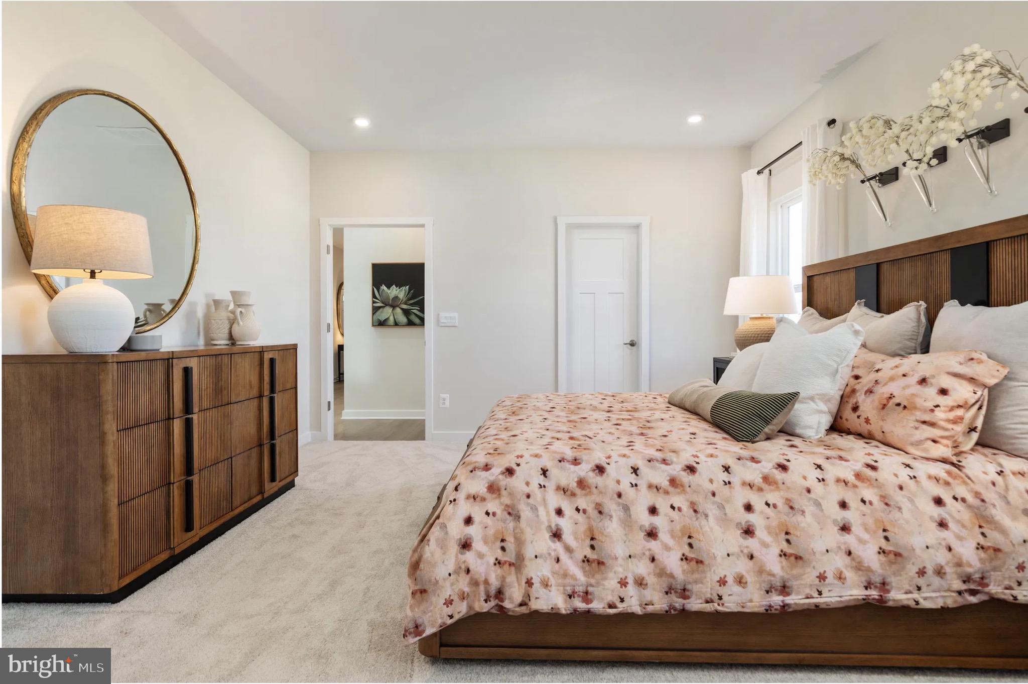 4 Bowens Run Road Bealeton, VA 22712 - Photo 13 of 21 a bedroom with a large bed and a chandelier