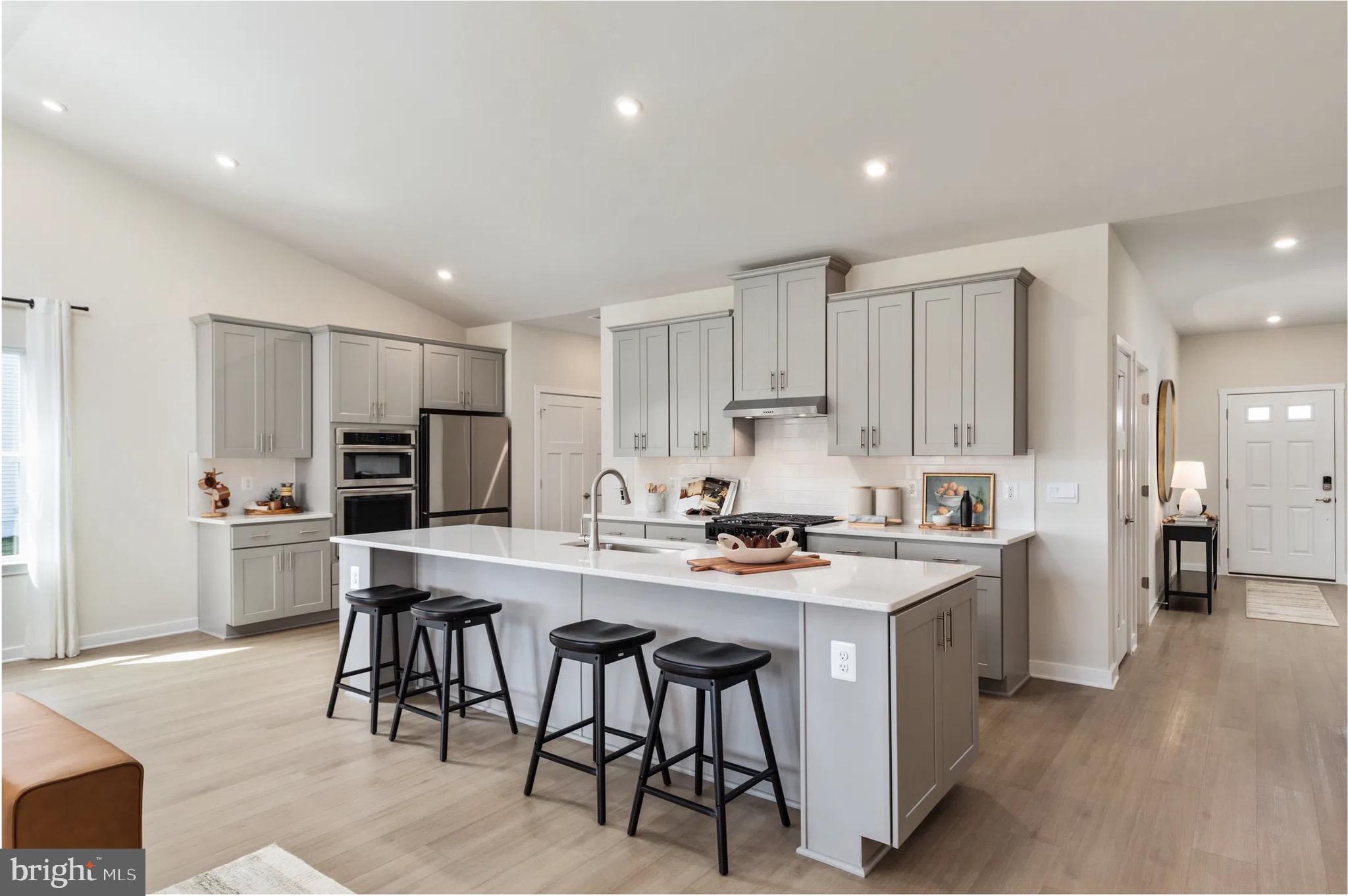 4 Bowens Run Road Bealeton, VA 22712 - Photo 4 of 21 a kitchen with stainless steel appliances a stove a sink a refrigerator and cabinets