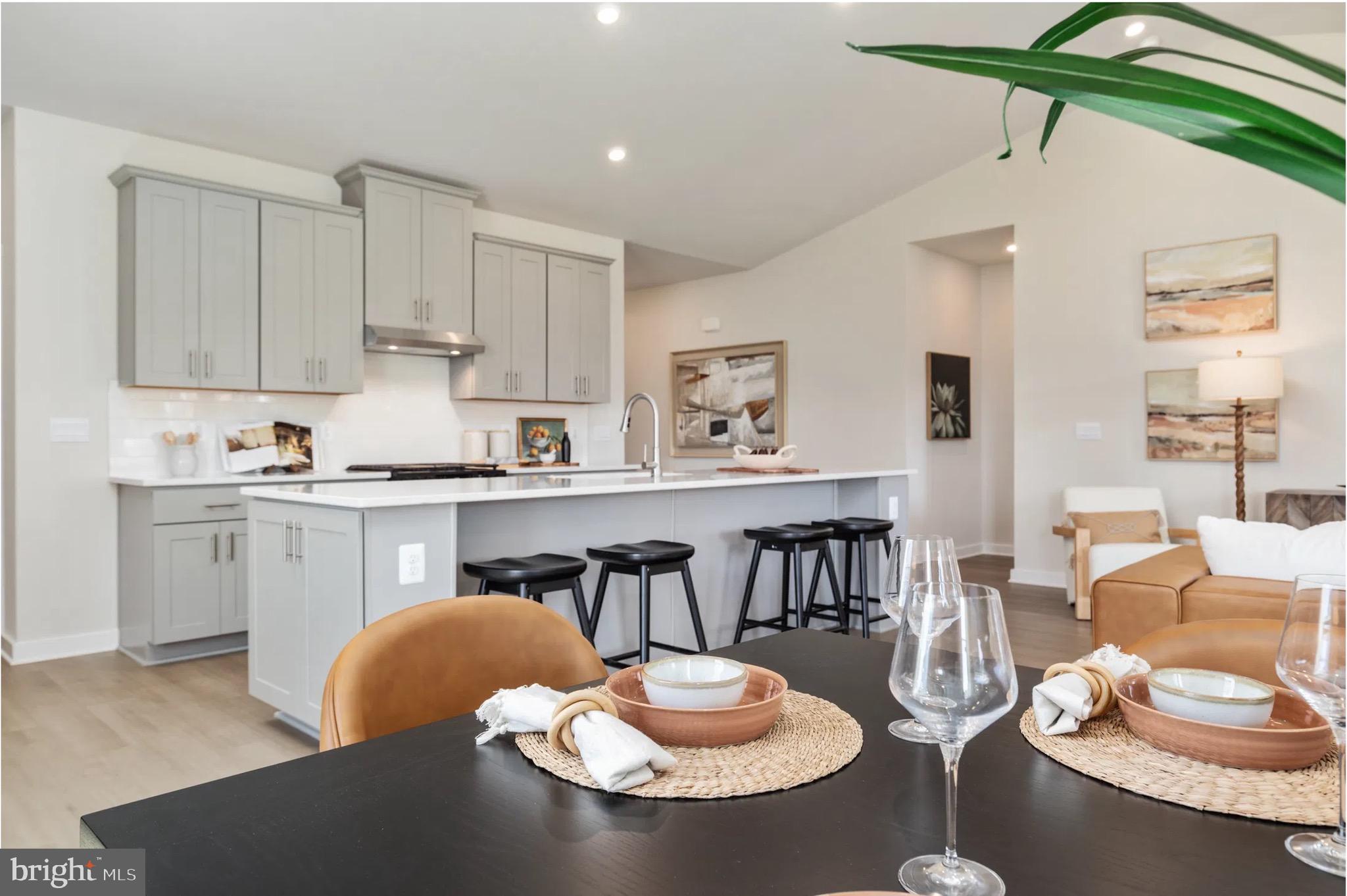 4 Bowens Run Road Bealeton, VA 22712 - Photo 7 of 21 a kitchen with stainless steel appliances a dining table and chairs