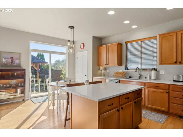 a kitchen with a stove a sink and a refrigerator