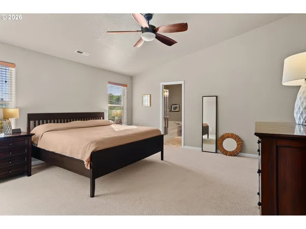 a bedroom with a bed and a table