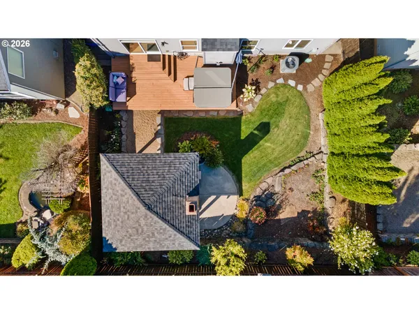 an aerial view of a house with a swimming pool