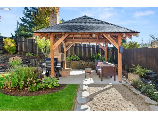 a backyard of a house with a garden and plants