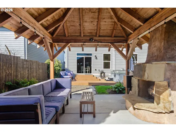 a view of a backyard with plants and a garden