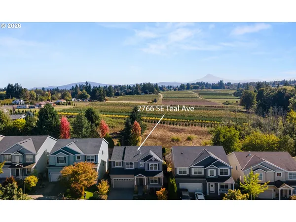 a aerial view of a house with a lake view